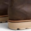 Close-up of the heel counter on the Anzhou 301 brown leather waterproof safety boot, showing stitching detail and wedge sole
