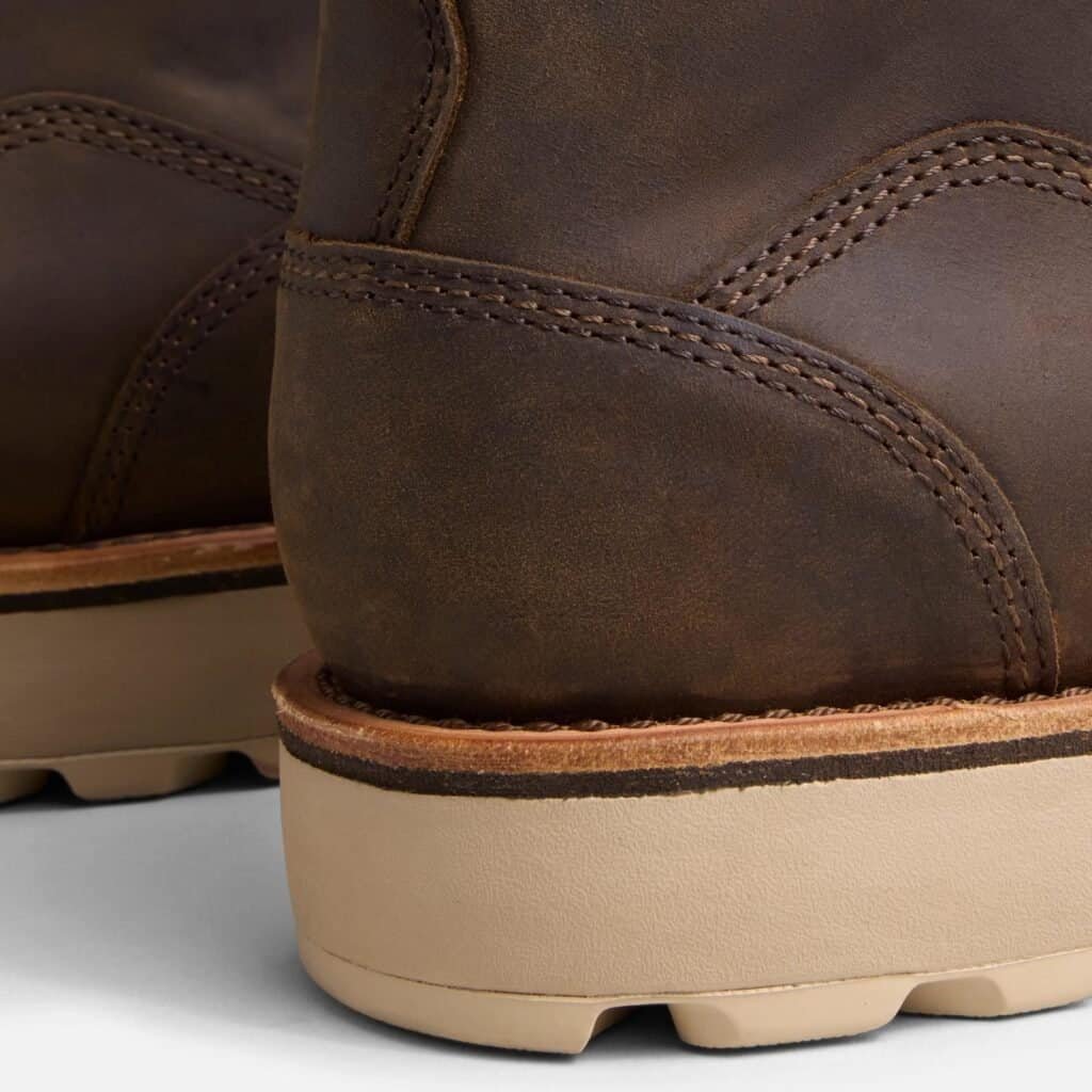 Close-up of the heel counter on the Anzhou 301 brown leather waterproof safety boot, showing stitching detail and wedge sole